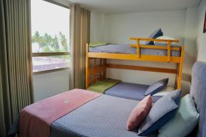 a bedroom with two bunk beds and a window at HOTEL LA VIEJA SARA RIOHACHA in Ríohacha +40 photos