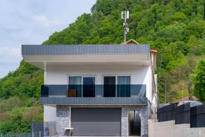 a house on the side of a mountain at Prenočišča Dany in Dravograd