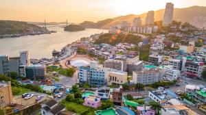 an aerial view of a city with a river and buildings at Yeosu Onueli Pension in Yeosu