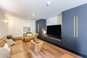 a living room with a couch and a tv at 5 Bed in Bishops Lydeard oc-b45427 in  Liscombe
