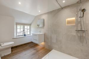 a bathroom with a shower and a toilet and a sink at 5 Bed in Bishops Lydeard oc-b45427 in  Liscombe +31 photos