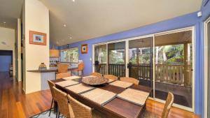 a dining room with a wooden table and chairs at MiaCasa in New Brighton