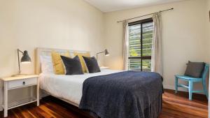 a bedroom with a bed and a window at L'Aqua by Lifestyle. in New Brighton