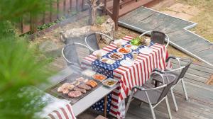 a picnic table with american flags and food on it at Gapyeong Solle Spa Pension in Gapyeong +10 photos