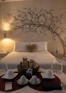 a bedroom with a bed with a basket of bread at OLYMPUS PARK amnesia in Mesagne