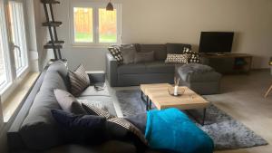 a living room with a couch and a coffee table at Ferienwohnung Für 4 Personen 90 M² in Naumburg