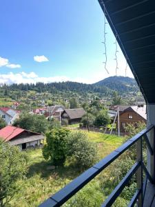 a view of a village from the balcony of a house at Grey House in Slavske