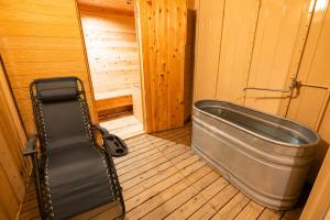 a large metal tub sitting in a room at YASAKA Hotel in Kagoshima