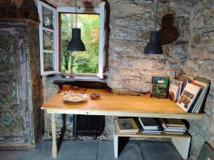 a wooden table in a room with a window at Mühle am Sandbach in Niedererbach