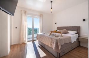 a bedroom with a bed and a large window at Villa Tea Polača Biograd na moru Benkovac in Polača +60 photos