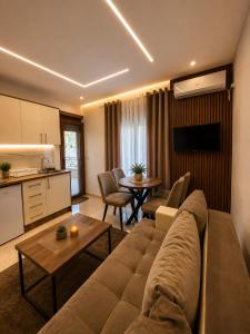 a living room with a couch and a table at Arbneshi Apartments in Ulcinj