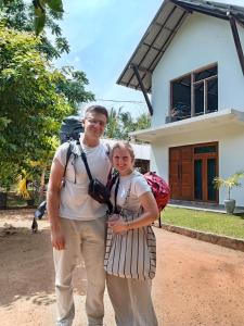 a man and a woman standing in front of a house at Golden Gate Ceylon in Anuradhapura