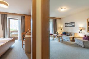 a living room with a couch and a table at Residence Grünwald in Valles