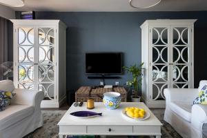 a living room with a couch and a table at St Angelo Mansions 3BDR flat with Seaview in Vittoriosa