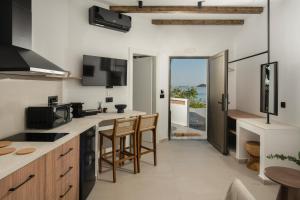 a kitchen with a view of the ocean at Aiolos Suites in Rhodes Town