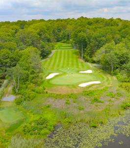 an overhead view of a golf course with a green at The Emerald Cabin in Tobyhanna