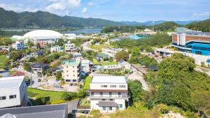 an aerial view of a town with a river and buildings at Chuncheon Lio Pension in Chuncheon