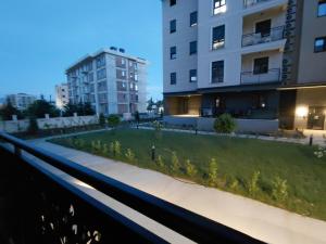 a park in the middle of a city with buildings at Prolink Residence Podgorica in Podgorica