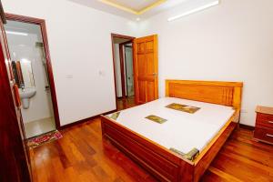 a bedroom with a bed and a bathroom at BTLk D16- 27-02 in Thủy Triều