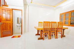 a dining room with a table and chairs and a toilet at BTLk D16- 27-02 in Thủy Triều