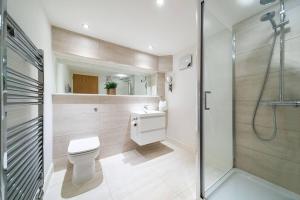 a bathroom with a toilet and a shower at Whinny Brae in Broughty Ferry +18 photos