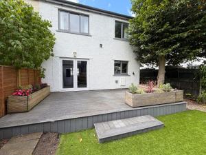 a house with a large patio in front of it at Red Robin in Keswick +7 photos