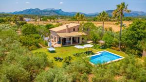an aerial view of a house with a swimming pool at Mercader in Alcudia