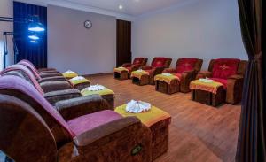 a waiting room with a bunch of chairs and tables at Hotel Sapa Square, Affiliated by Meliá in Sapa