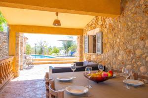 a dining room with a table with wine glasses at Raco De Can Pep in Inca