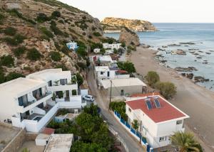 an aerial view of a beach with white houses at Aiolos Suites in Rhodes Town