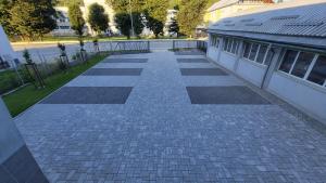 an overhead view of a brick walkway next to a building at Penzion DRUCKER in Čadca