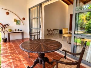 a dining room with a table and chairs in a room at Villa Blue Lotus Katunayake- Colombo Airport in Katunayaka