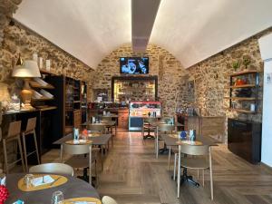 a restaurant with tables and chairs in a room at Domus Maris Relais Boutique Hotel in Sciacca