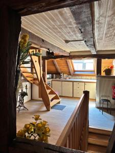 a house with a staircase in the middle of a room at Chambres d'hôtes chez Adam 