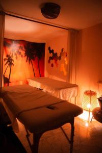 a bedroom with two beds and a table in it at Green therapy - Wellness resort in Bet Dagan