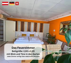 a hotel room with a bed and a couch at Dreamly Suites Oslip in Oslip +18 photos