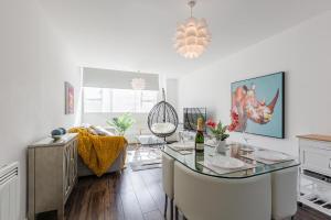 a kitchen with a table and a dining room at Liver Building View in Liverpool