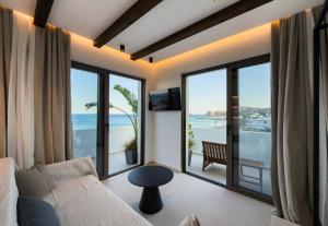 a living room with a view of the ocean at Aiolos Suites in Rhodes Town +98 photos