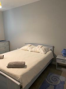 a bedroom with a bed with a pillow on it at Era in Chancelade