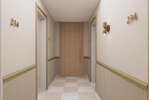 a hallway with a door and a tile floor at Casa Azure Meliá Collection in San Lawrenz
