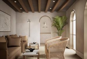 a living room with a couch and chairs at Casa Azure Meliá Collection in San Lawrenz