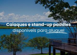 a view of a lake with the words calcuttes and stand up paddles at Morro Redondo - Bangalôs com vista do lago e da serra in CÃ¡ssia +59 photos