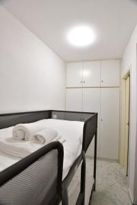 a bedroom with a bed with towels on it at Gran Paradiso Guest House in Tivoli +7 photos