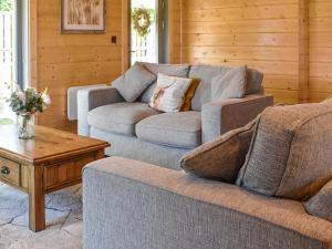 a living room with two couches and a coffee table at Oak Lodge - Uk30005 in Lindal in Furness