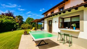 a pool in the backyard of a house at Villa Costa Cue in Cue
