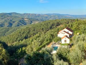an aerial view of a house in the hills at Lugar dos Meandros  +12 photos