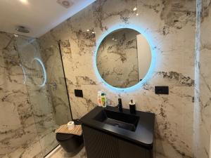 a bathroom with a sink and a mirror at SD House in Vlorë