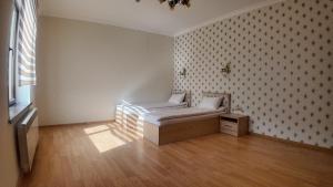 a small room with a bed and a window at Sadaxlı Hotel & Restaurant in Şǝrǝdil +18 photos