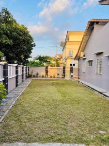 an empty yard in a backyard of a house at Homestay Permai Inn in Temerloh