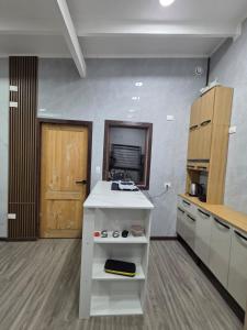 a kitchen with a white counter in a room at Casa en Lanco in Lanco +6 photos